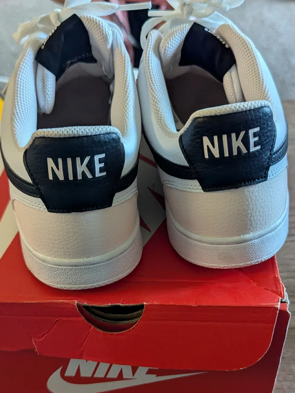 Nike Men’s White Leather Sneakers with Black Swoosh